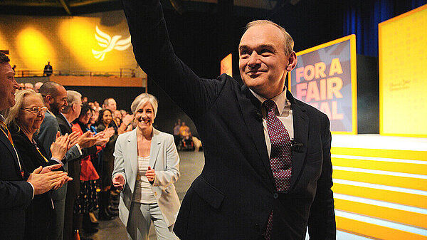 Ed davey at conference waving